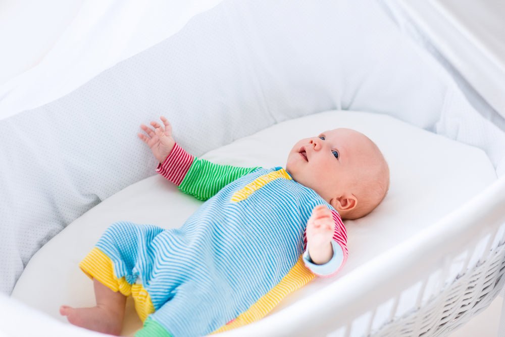 Newborn Baby Sleeping In Bassinet newborn-baby-sleeping-in-bassinet