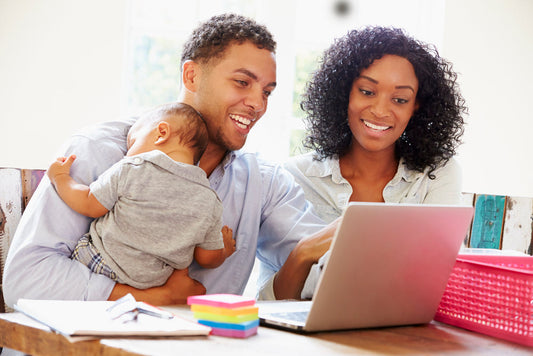 Two parents working from home with a baby