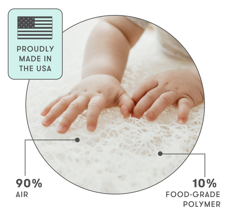 A baby's hands on a white background with the text "Proudly made in the USA," highlighting safe sleep technology.