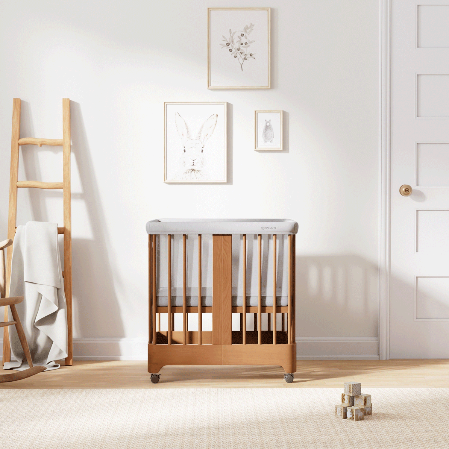 Gif of chestnut color Newton Nest Convertible Crib in all of its different possible conversions, in a beautiful nursery 999-8440-CST-C1