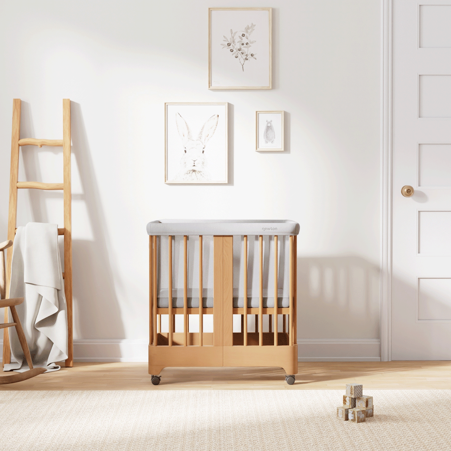 Gif of natural color Newton Nest Convertible Crib in all of its different possible conversions, in a beautiful nursery  999-8440-NAT-C1