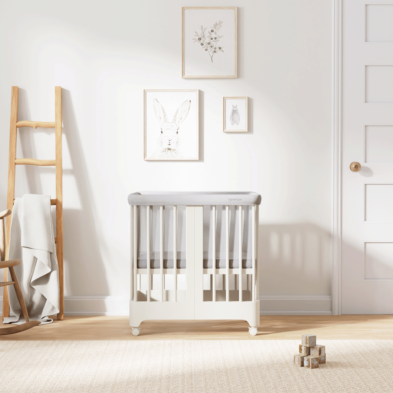 Gif of warm white color Newton Nest Convertible Crib in all of its different possible conversions, in a beautiful nursery 
999-8440-WRW-C1