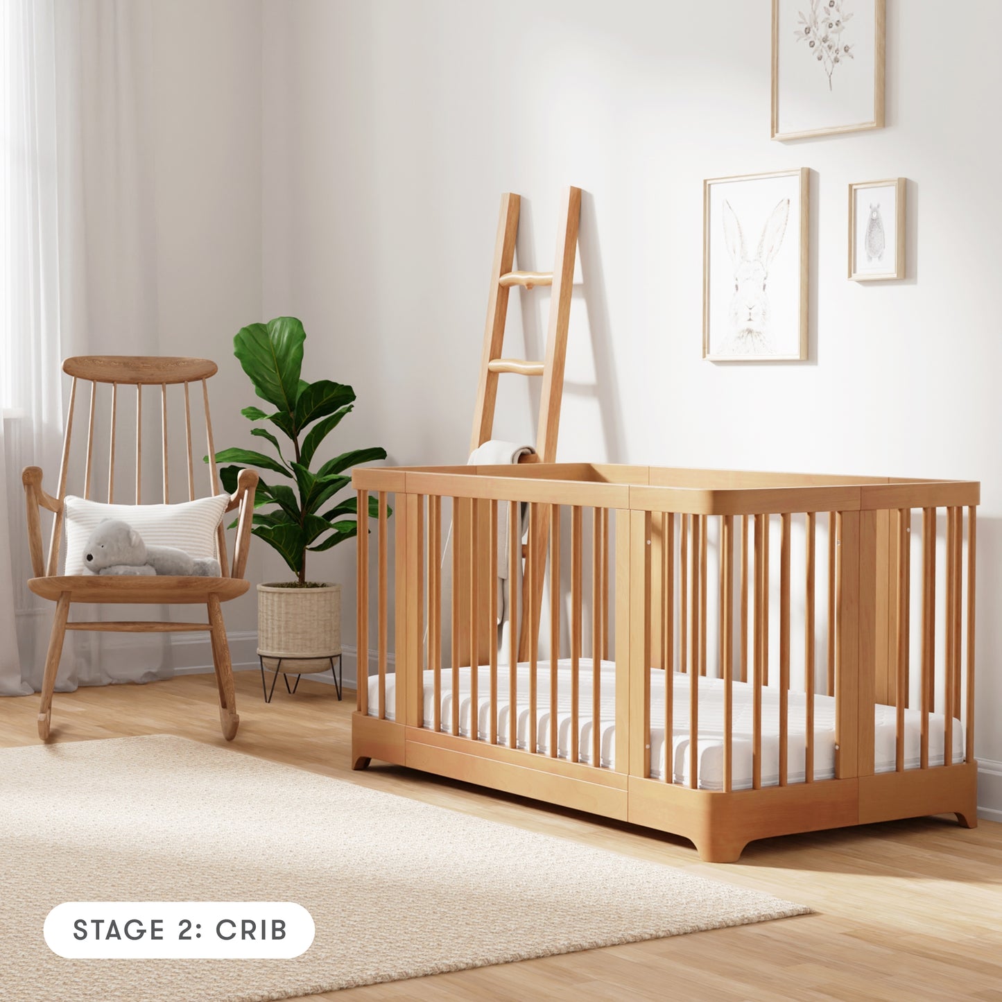 Natural color Newton Nest Convertible Crib in crib setting, in nursery next to rocking chair, with text "Stage 2: Crib"