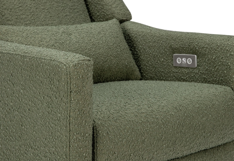 Close-up view of a green upholstered sofa with a rectangular label displaying "oso".
