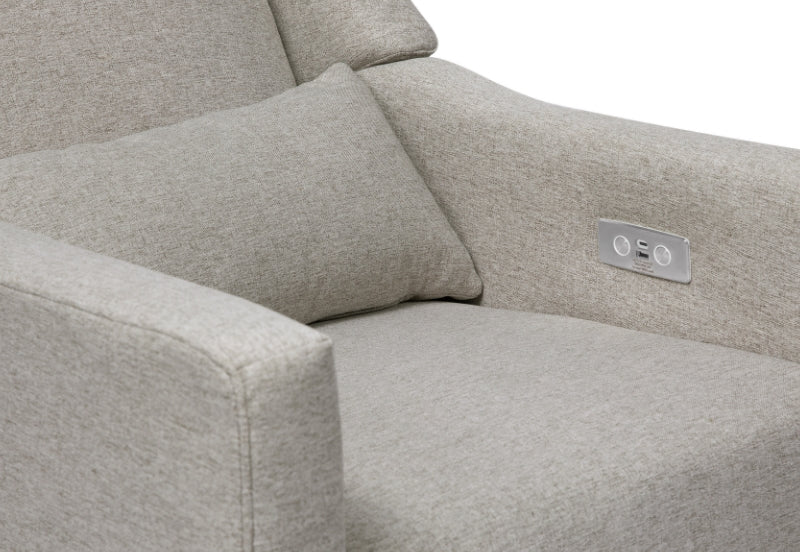 Close-up view of a light grey nursery chair with electronic control buttons on the side.