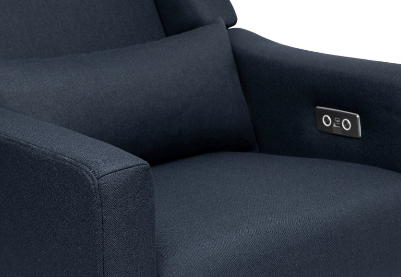 Close-up of a navy blue recliner chair's armrest with built-in control buttons.
