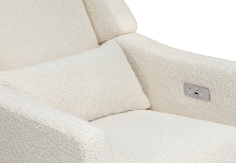 Close-up view of a cream-colored recliner with soft fabric and a visible control panel with adjustment buttons. 999-8605-SUN