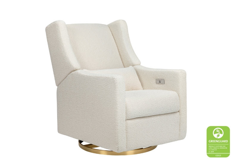Cream-colored upholstered rocking chair with a gold base, featuring a GREENGUARD Gold certification seal.