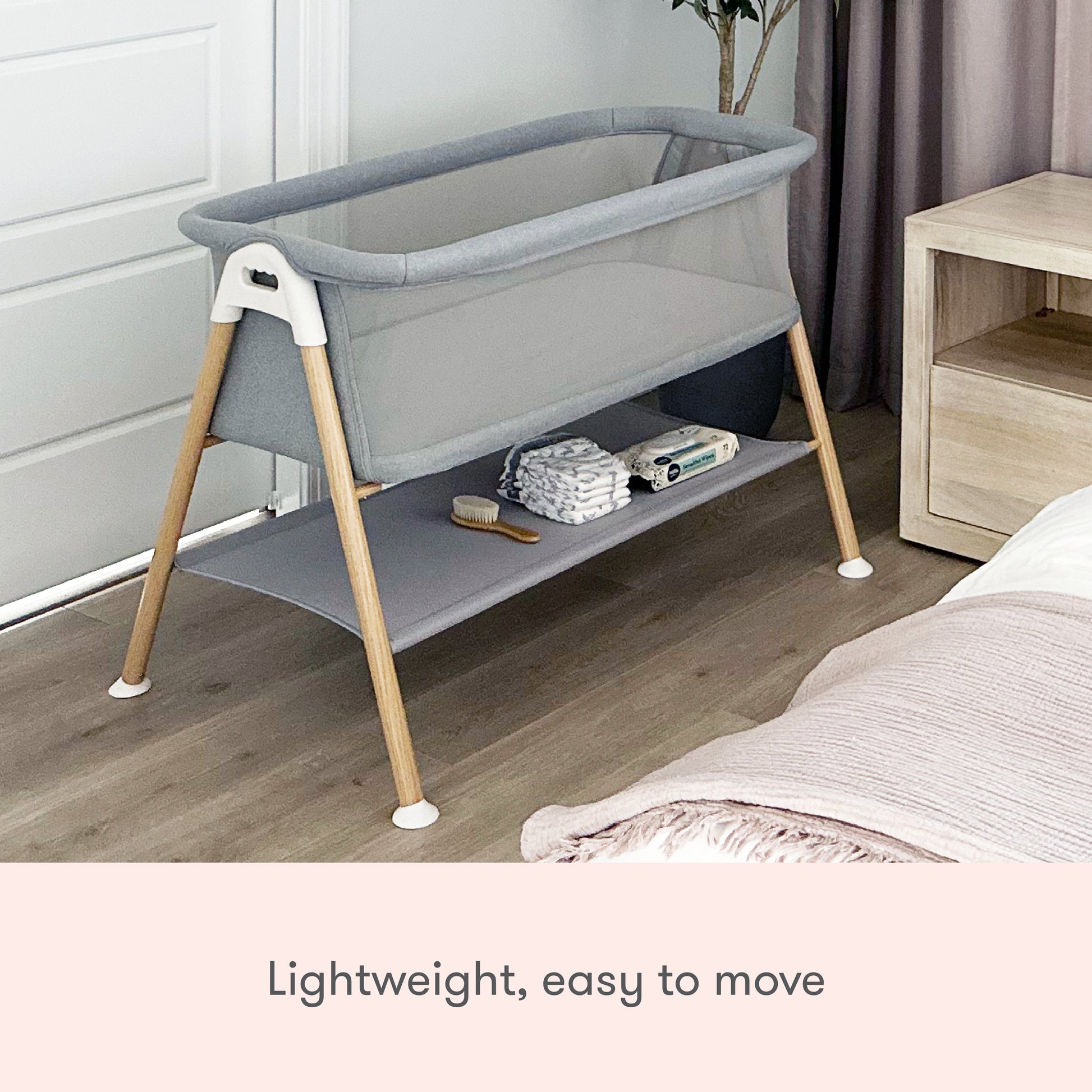 Essential bassinet with storage shelf in use, text reads "lightweight, easy to move"