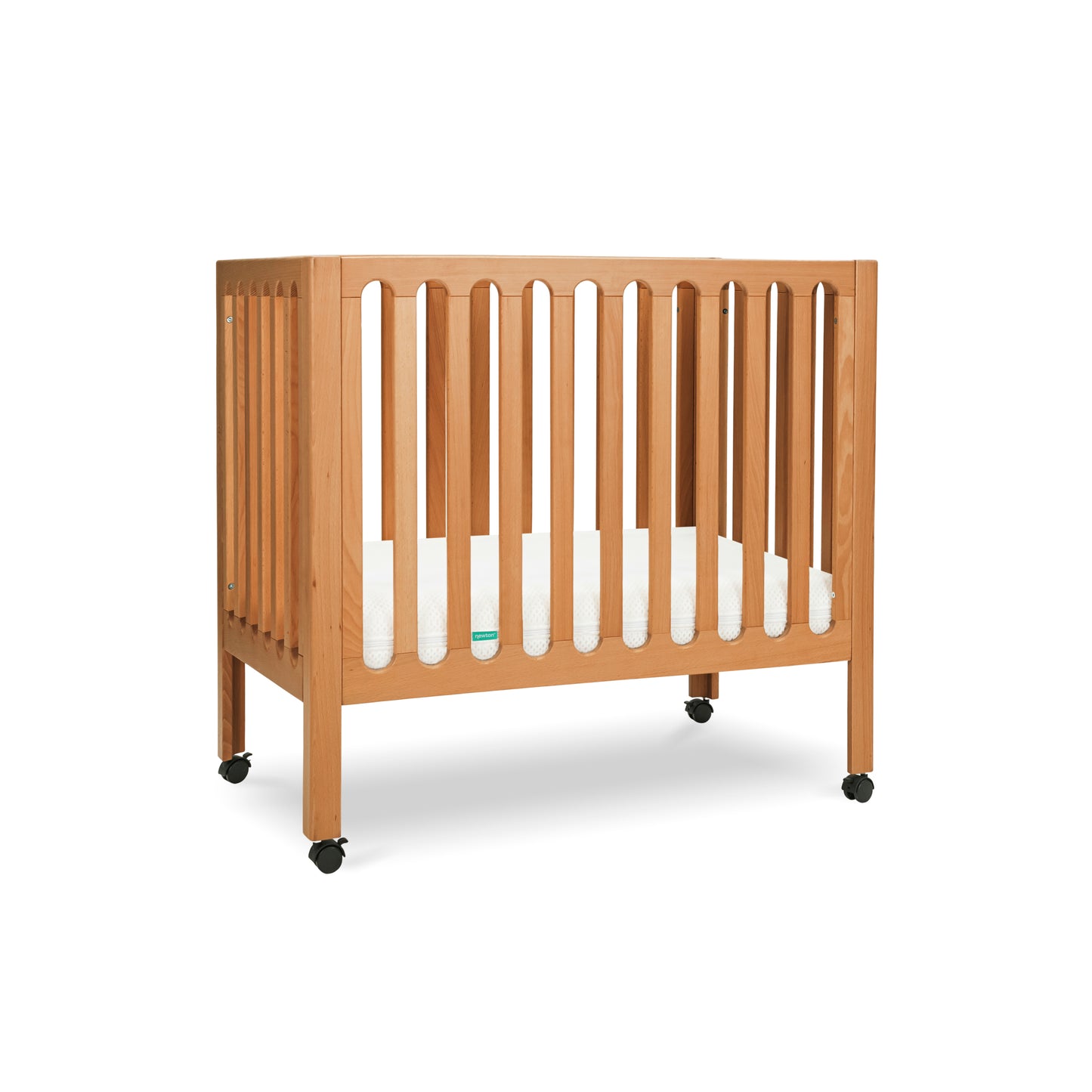 Modern wooden crib on wheels with visible mattress, isolated on a white background. 999-8430-CST