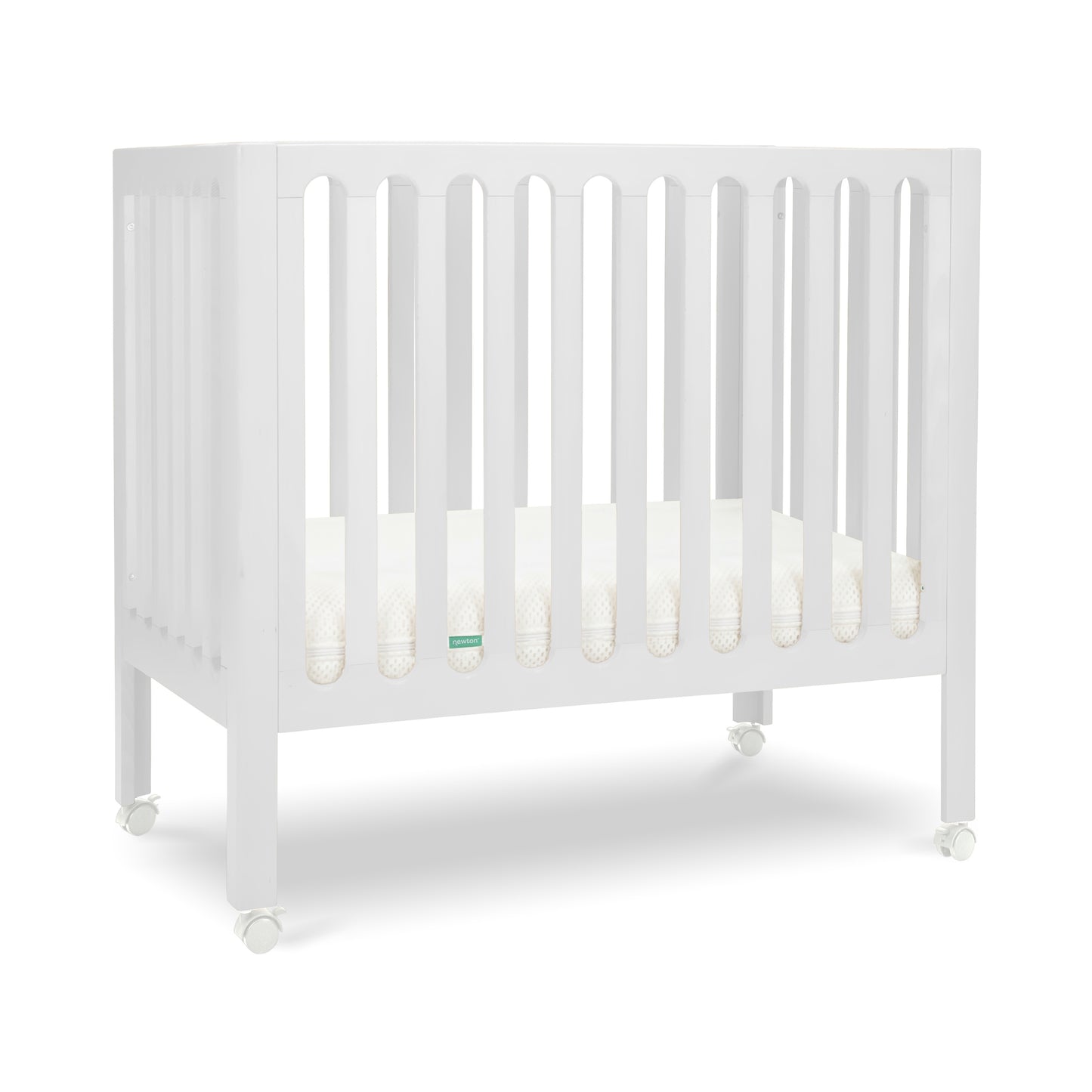 White modern crib on wheels with visible mattress, isolated on a plain background. 999-8430-WHT
