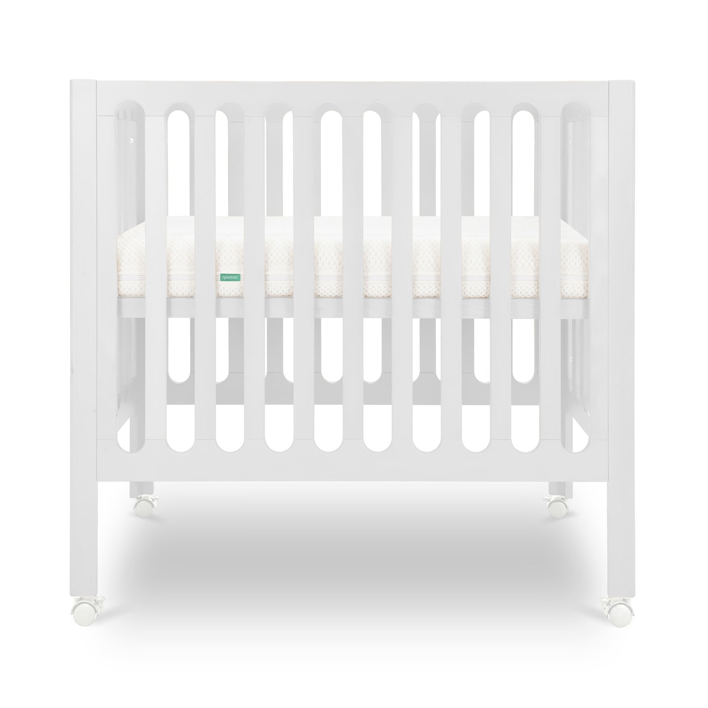 White modern crib on wheels with visible mattress, isolated on a plain background.