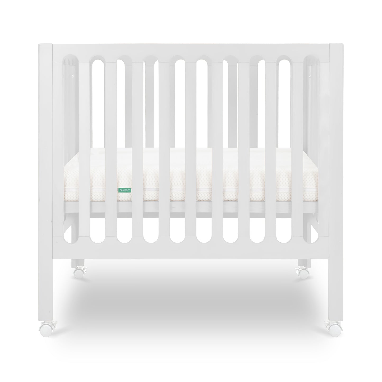 White modern crib on wheels with visible mattress, isolated on a plain background.