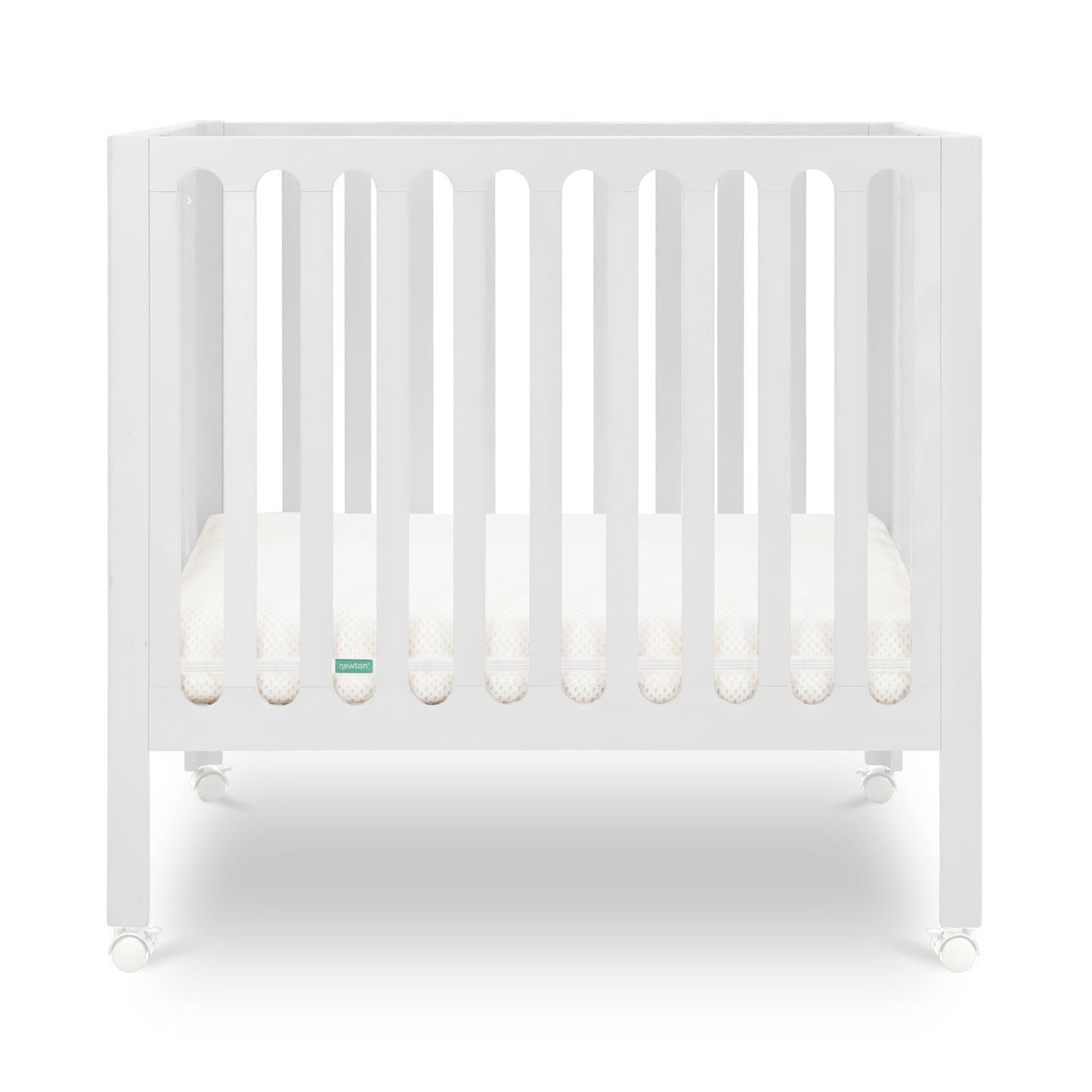 White modern crib on wheels with visible mattress, isolated on a plain background.