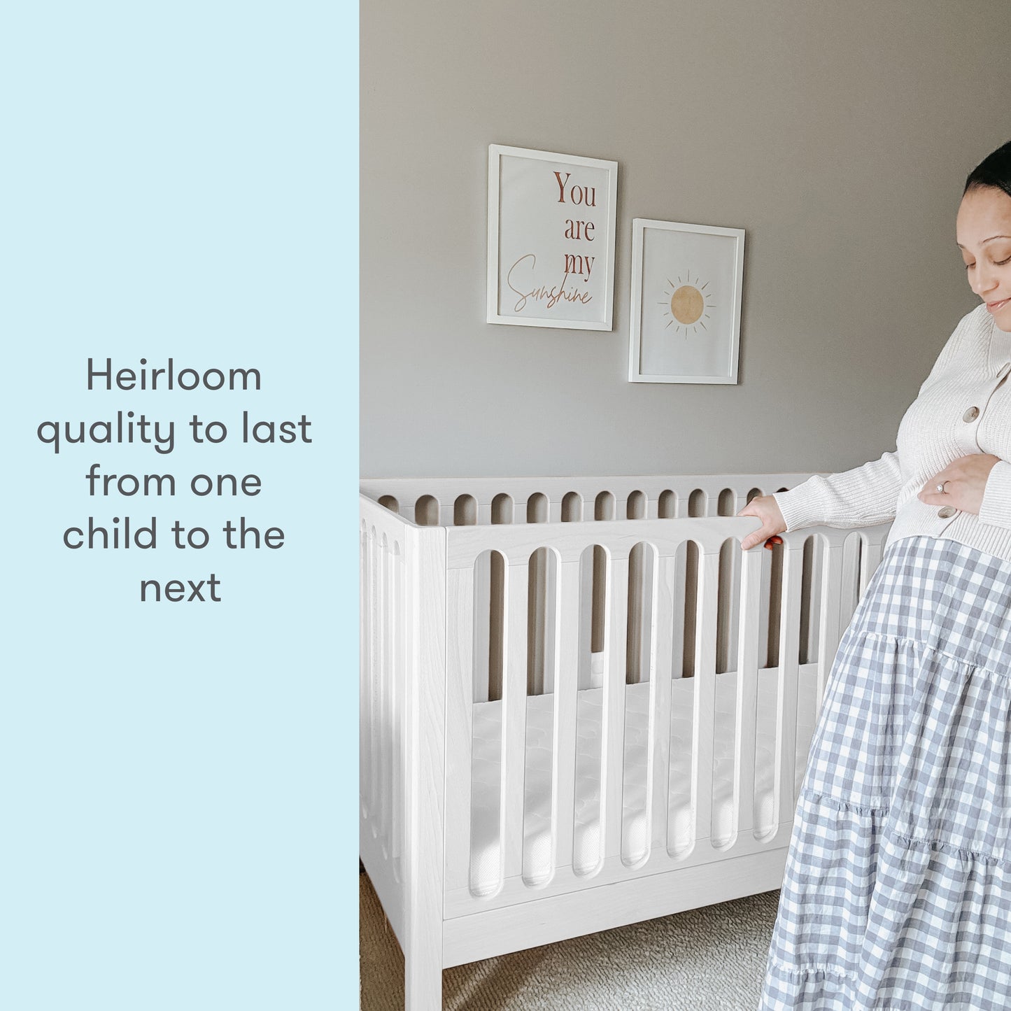 pregnant mom in a nursery standing next to newton galileo crib in Warm white color, text reads "heirloom quality to last from one child to the next"
