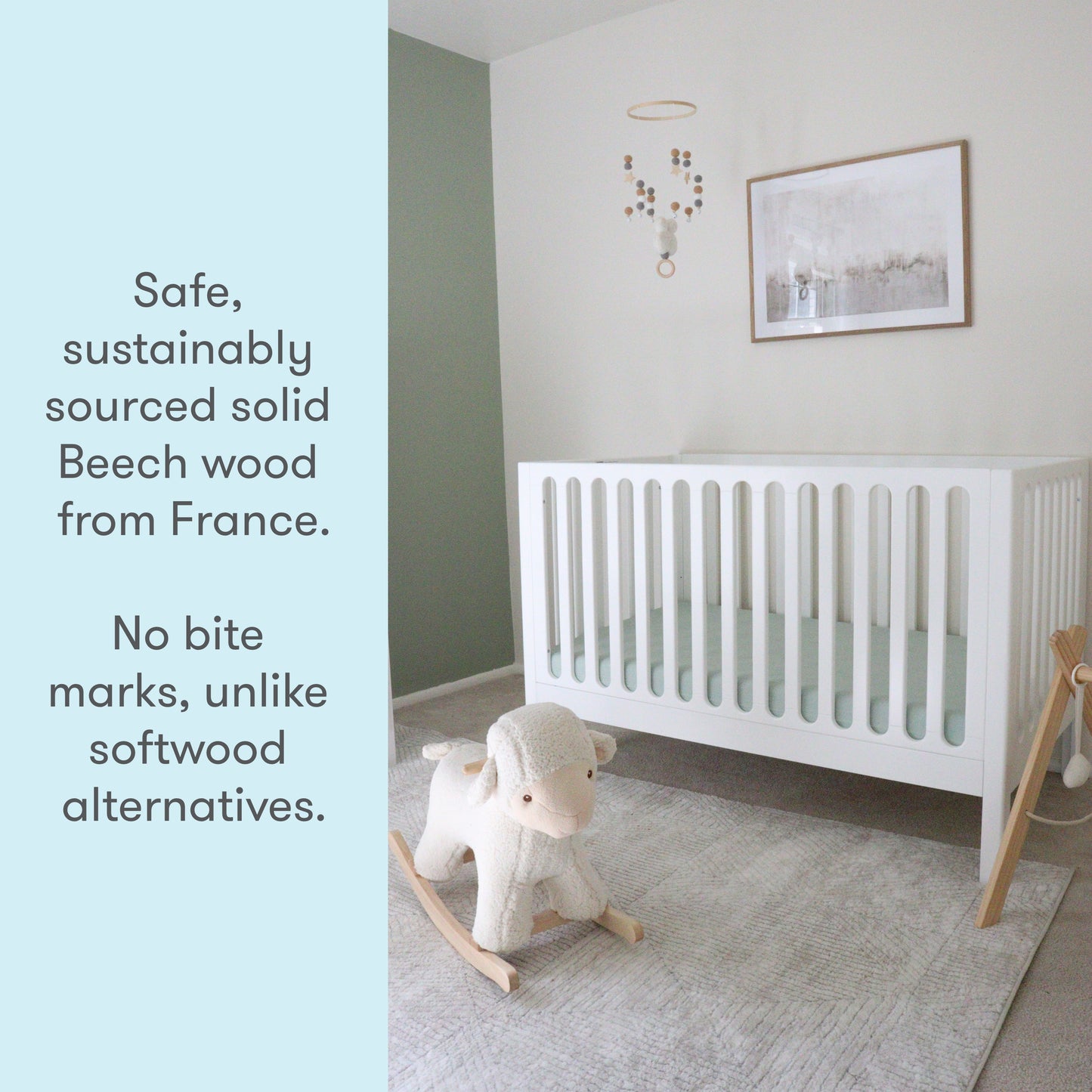 A baby's nursery featuring a white crib made from sustainably sourced solid Beech wood from France, accompanied by a text stating "Safe, sustainably sourced solid Beech wood from France. No bite marks, unlike softwood alternatives," with a toy sheep on a rocking base in the foreground.
