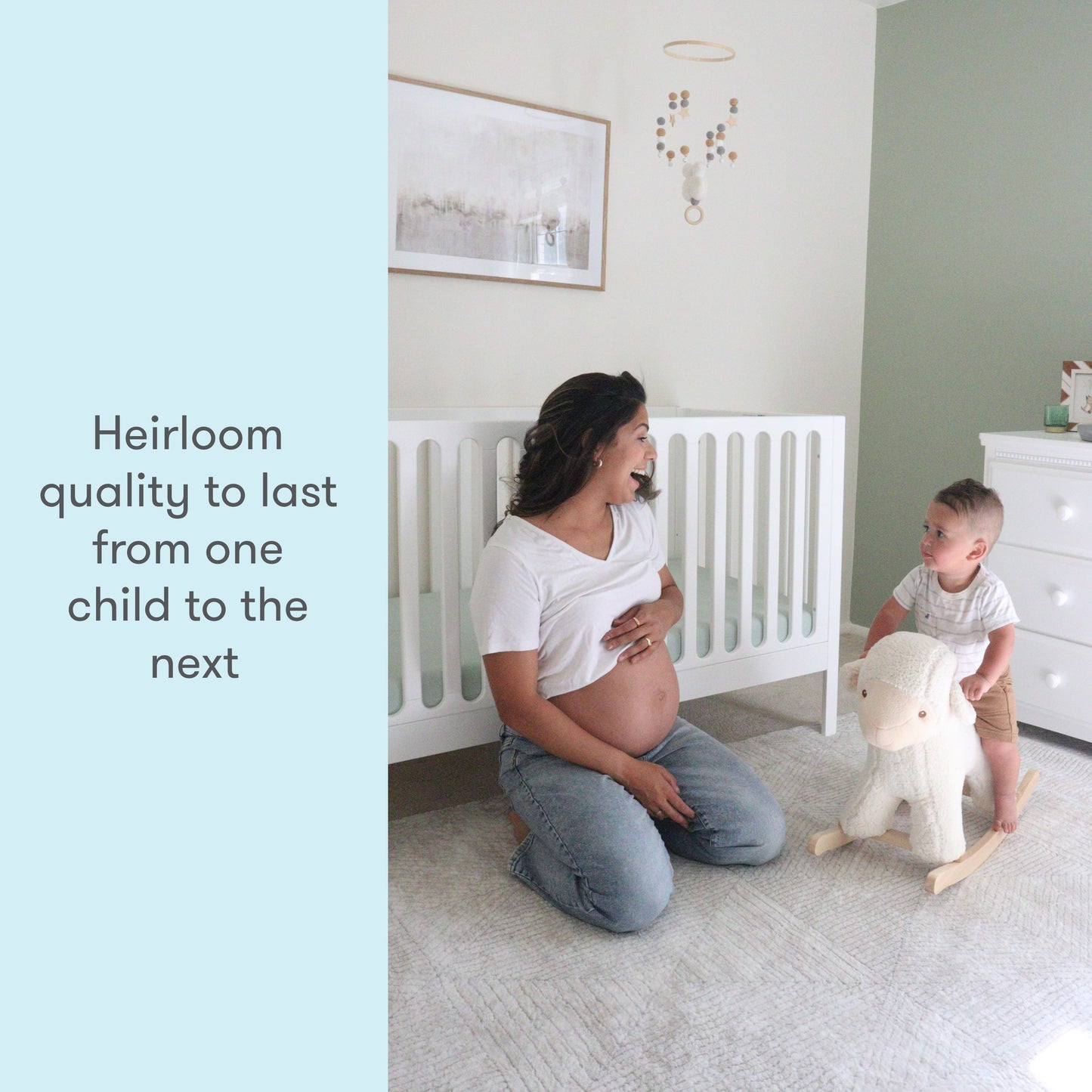 A pregnant woman kneeling smiles at a young child playing with a wooden toy in a nursery room with text stating "Heirloom quality to last from one child to the next."