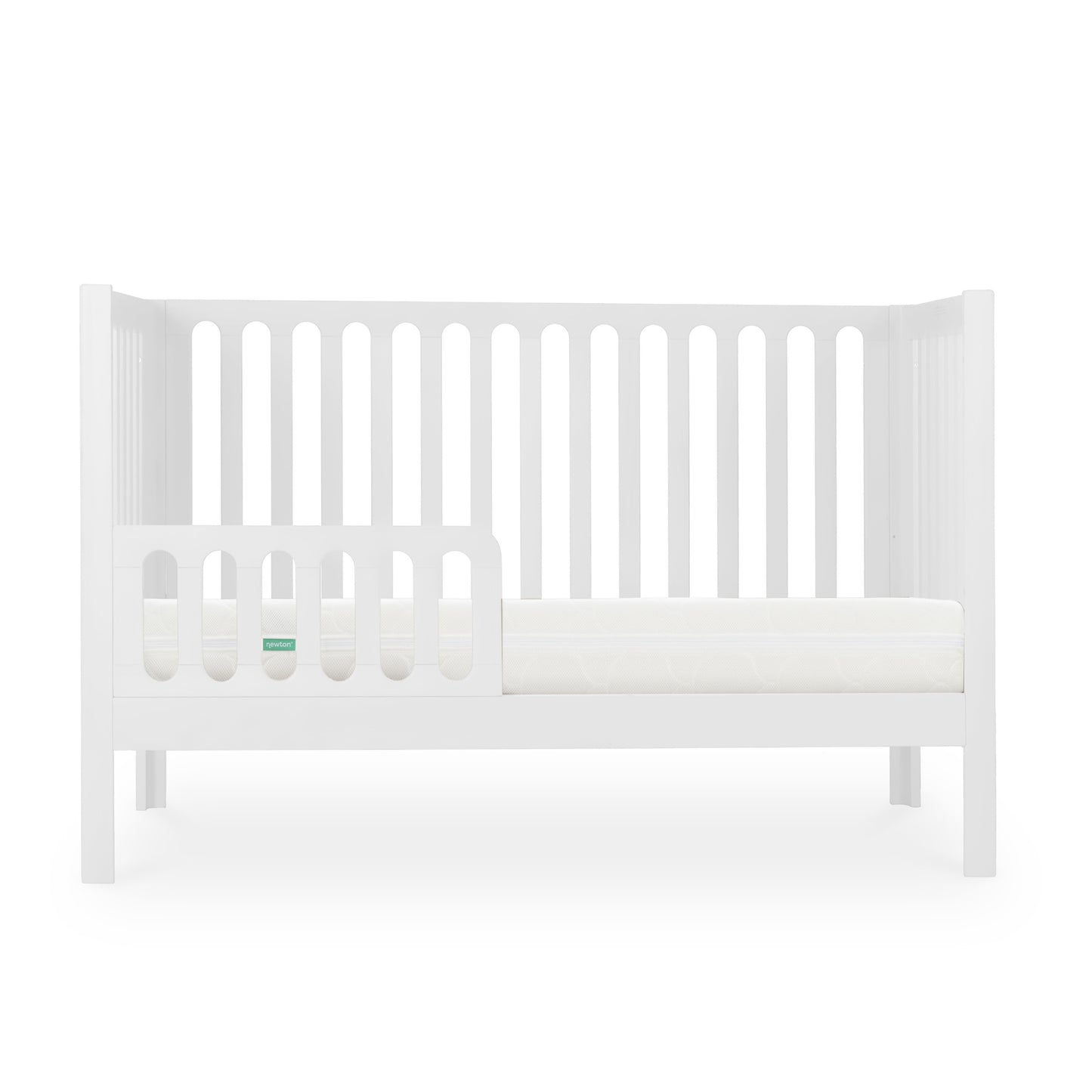 White modern baby crib with a Newton mattress visible, styled with minimalistic design on a plain background.