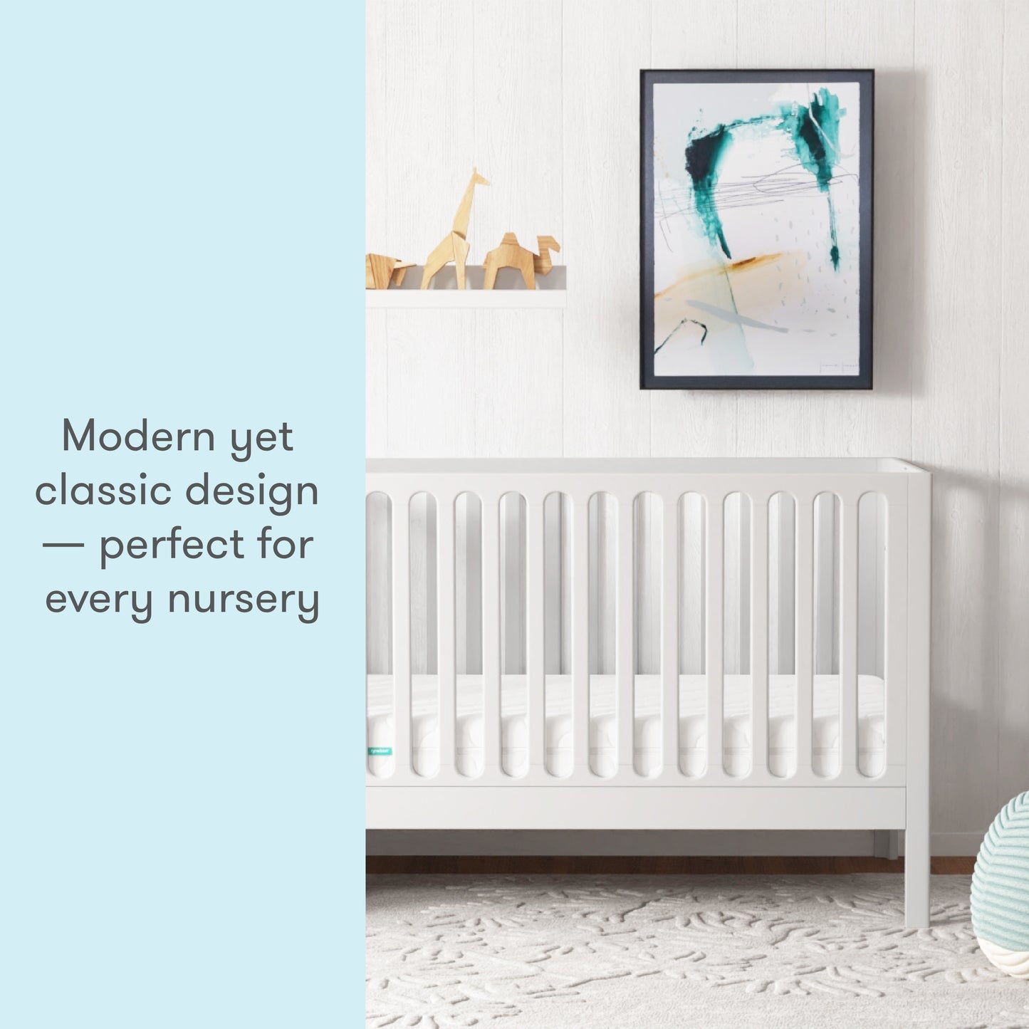 A modern yet classic white crib in a stylish nursery, with text stating "Modern yet classic design — perfect for every nursery."