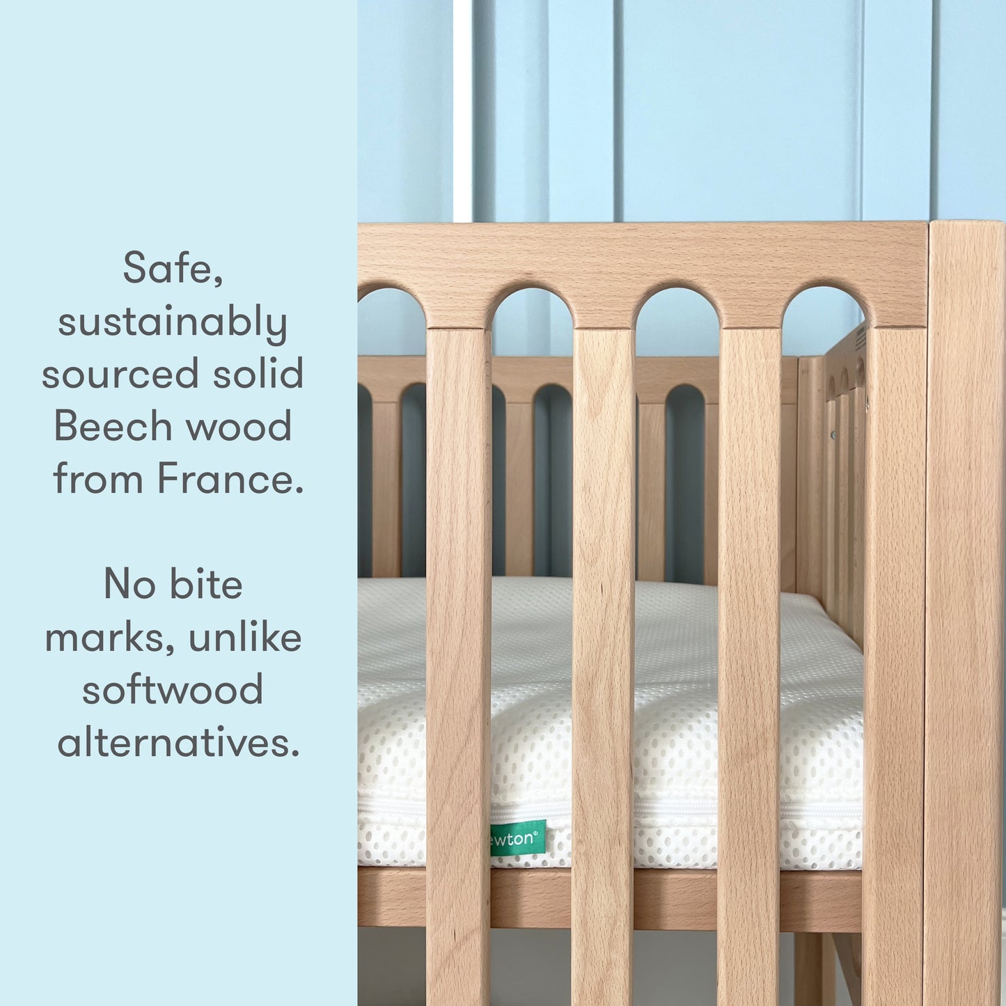 Close-up image of a crib made from safe, sustainably sourced solid Beech wood from France, highlighting its durability with "No bite marks, unlike softwood alternatives."