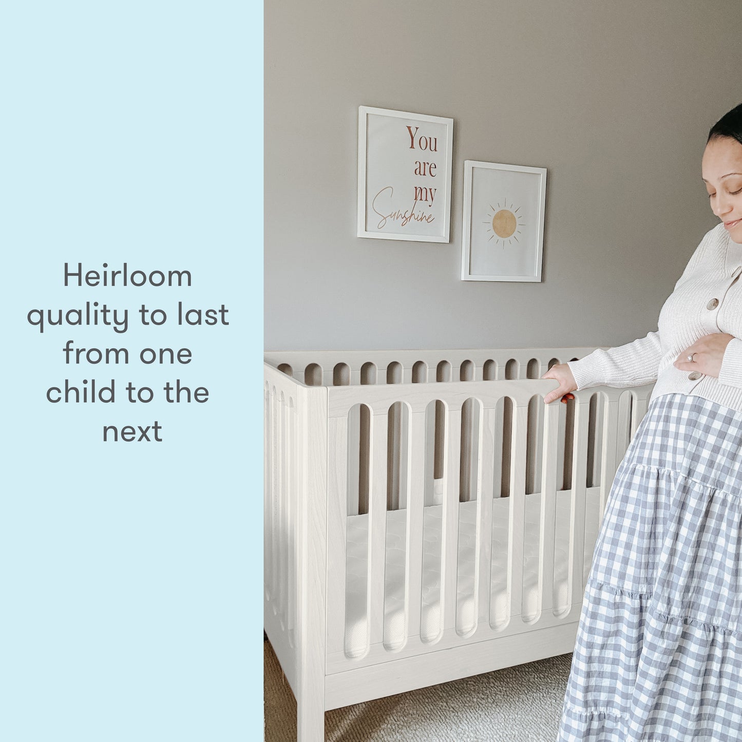 pregnant mom in a nursery standing next to newton galileo crib in Warm white color, text reads "heirloom quality to last from one child to the next"