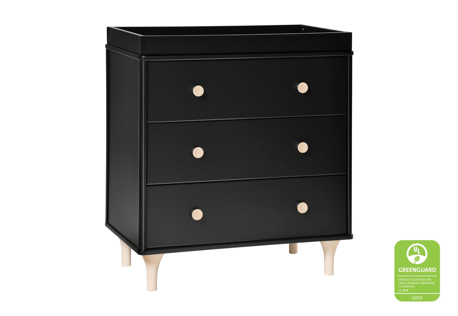 Black nursery dresser with three drawers, featuring natural wood legs and round light wood knobs, certified GREENGUARD Gold.