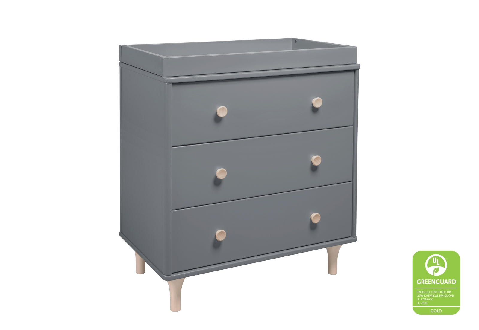 Gray nursery dresser with three drawers and wooden knobs, featuring a "GREENGUARD Gold Certified" seal on the bottom right.