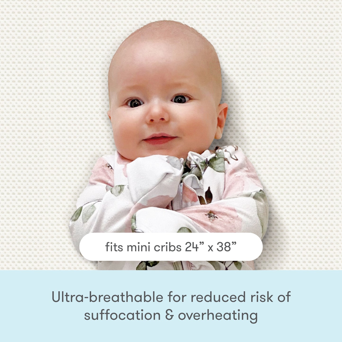 Smiling baby bundled in a floral outfit against a textured background with text: 'Ultra breathable for reduced risk of suffocation & overheating fits mini cribs 24"x 38"