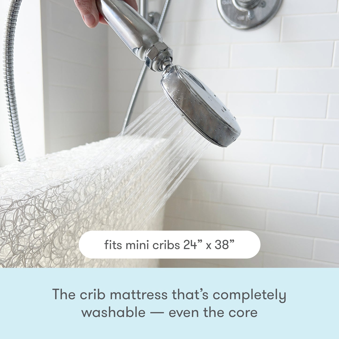Image of a crib mattress being washed under a showerhead with text that reads, "The crib mattress that's 100% washable — even the core."