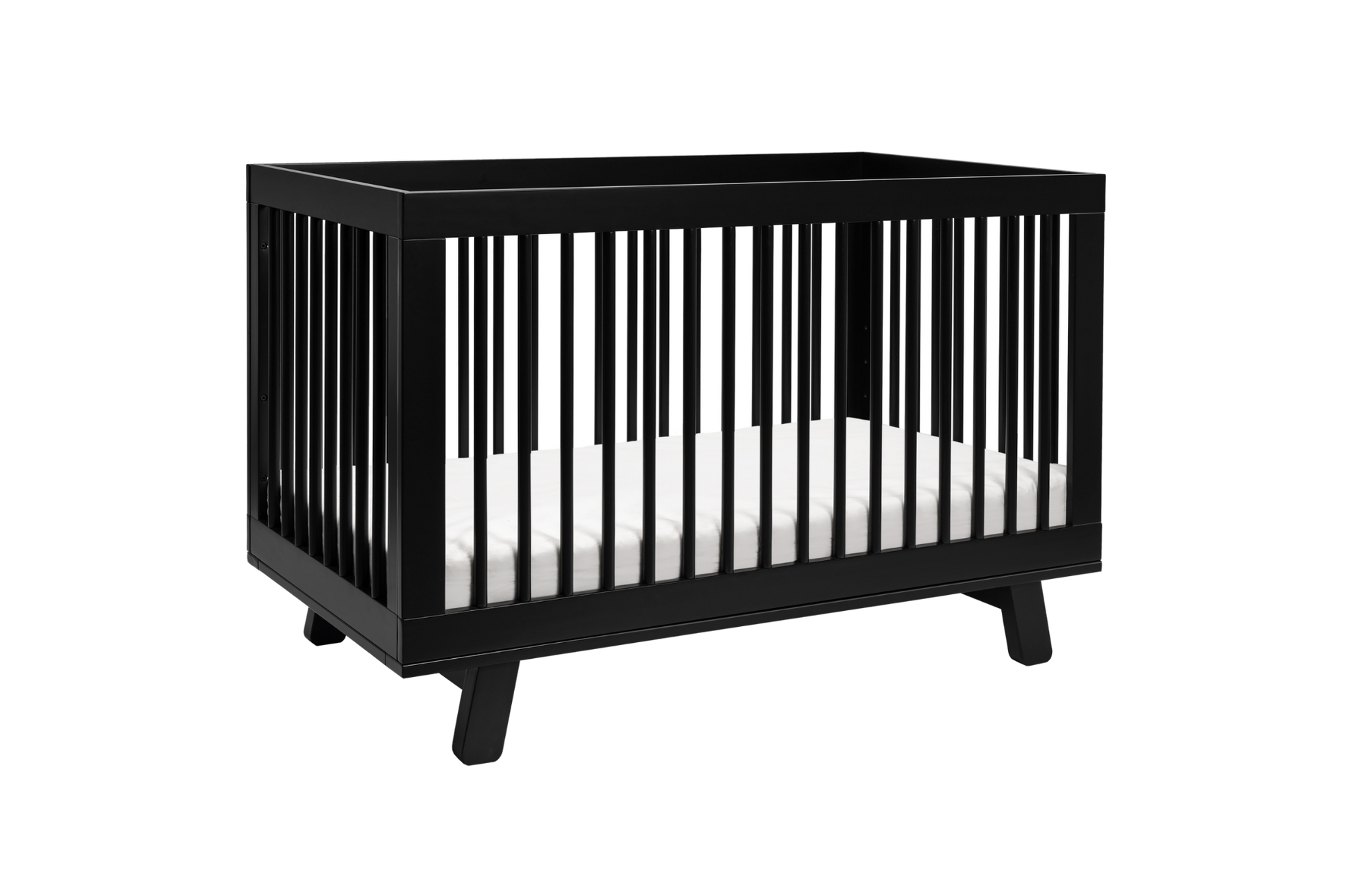 The Babyletto Hudson Convertible Crib in black features vertical slats on all sides and includes a white crib mattress, shown against a plain white background.