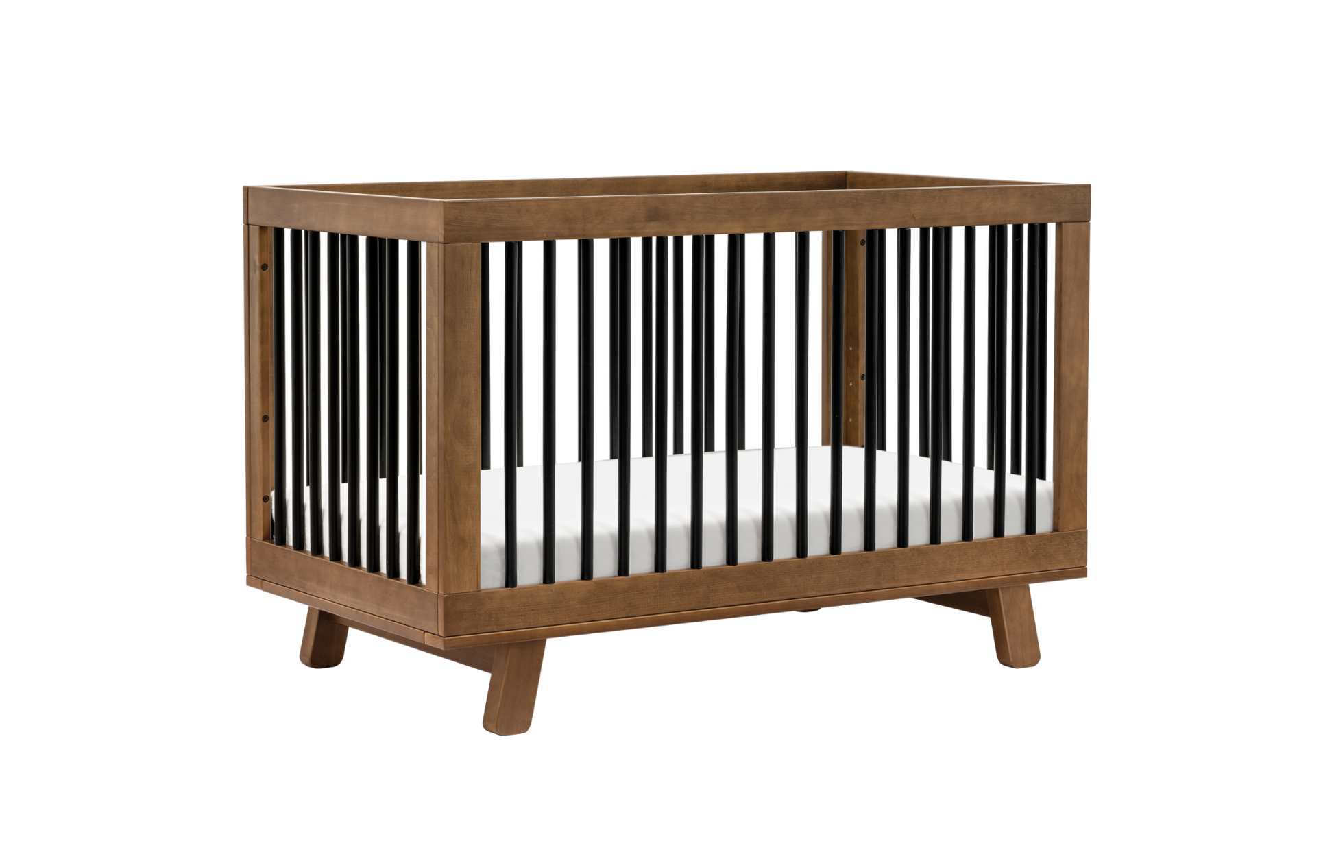 The Babyletto Hudson Convertible Crib features a modern wooden frame, angled legs, and vertical black slats with a white mattress—ideal for your child’s transition from crib to toddler bed.