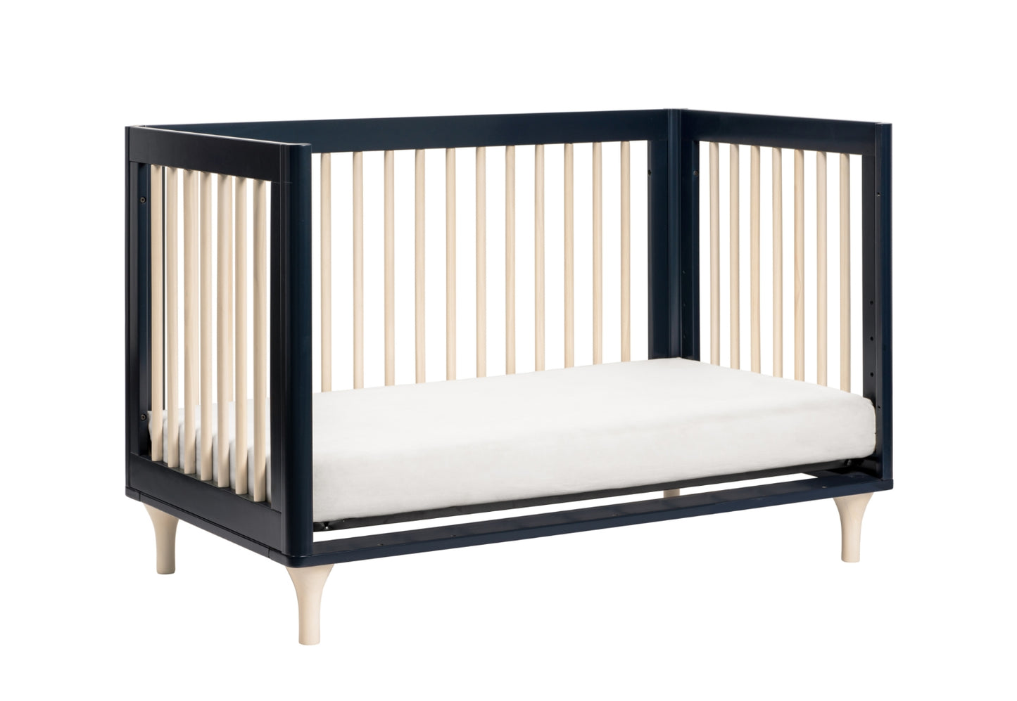 Modern black and white baby crib with vertical bars and a soft mattress.