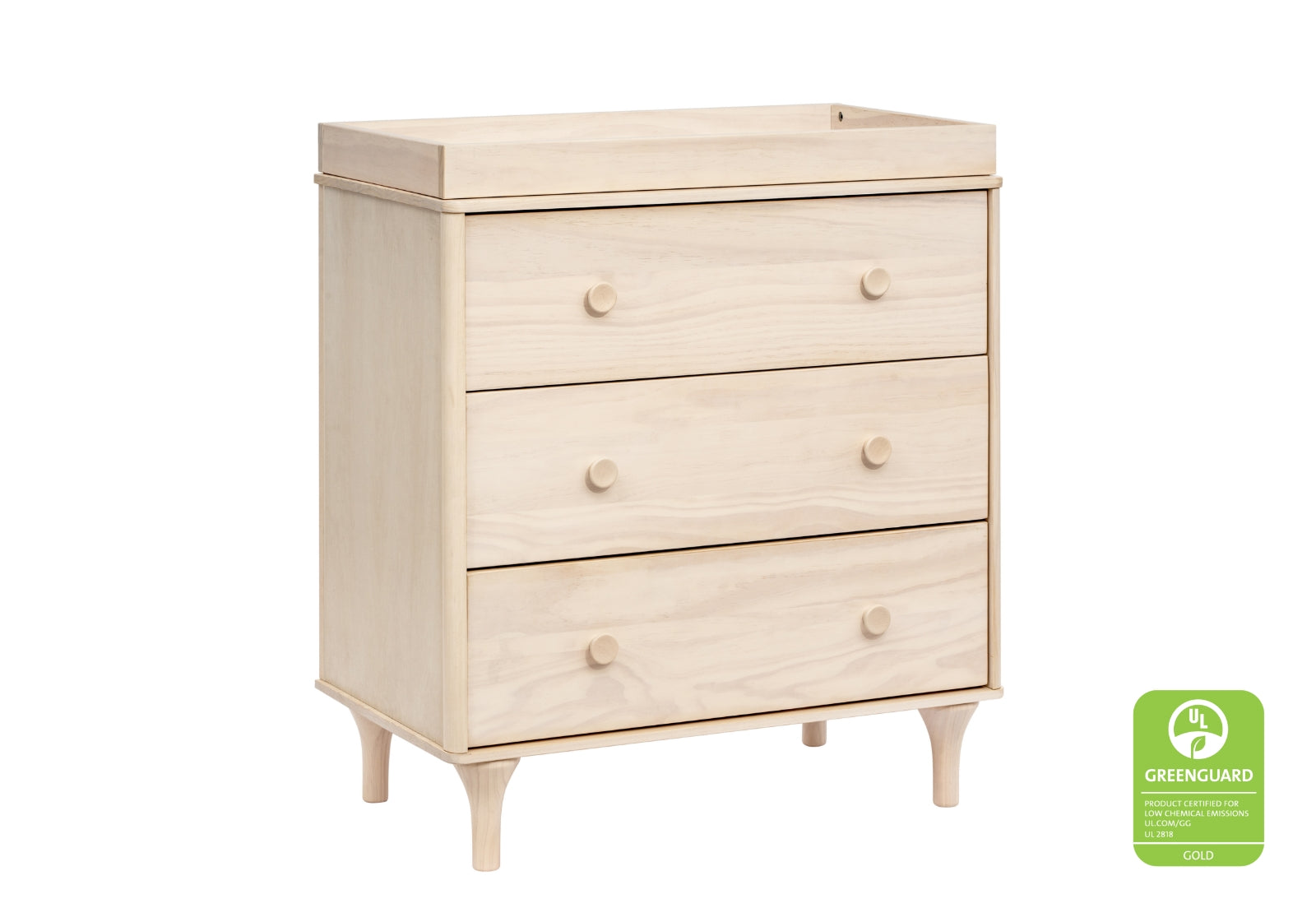 Light wooden baby changing table with three drawers and Greenguard Gold certification label on lower right.