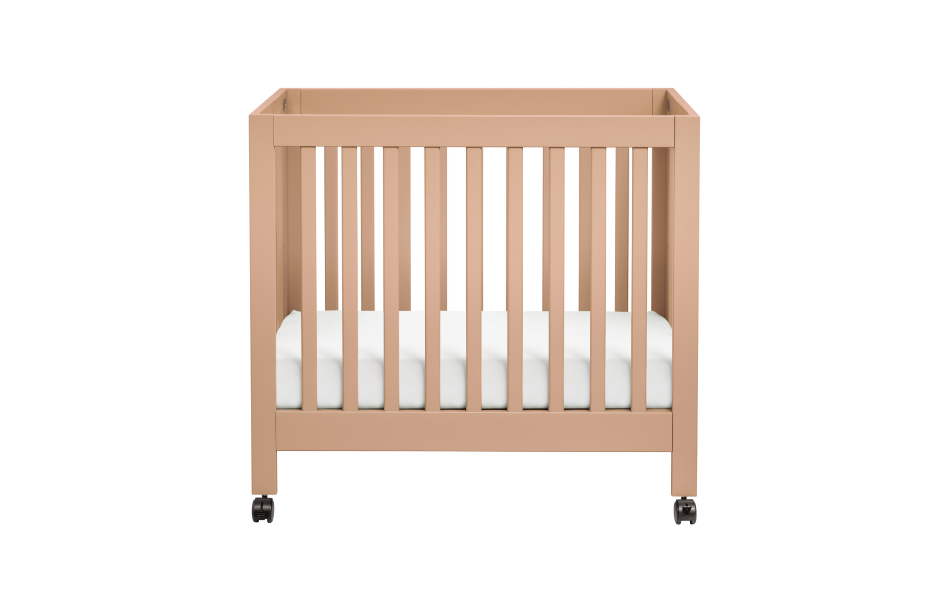 The Babyletto Origami Mini Crib, shown in light brown with vertical slats, a white mattress, and four small wheels, makes an ideal portable mini crib for small spaces—displayed against a plain white background.