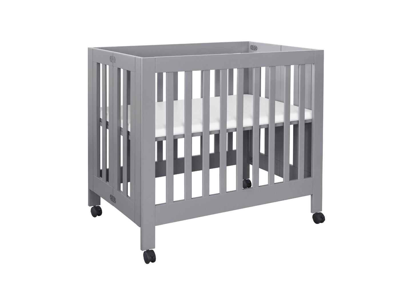 Gray modern baby crib with wheels on a white background.