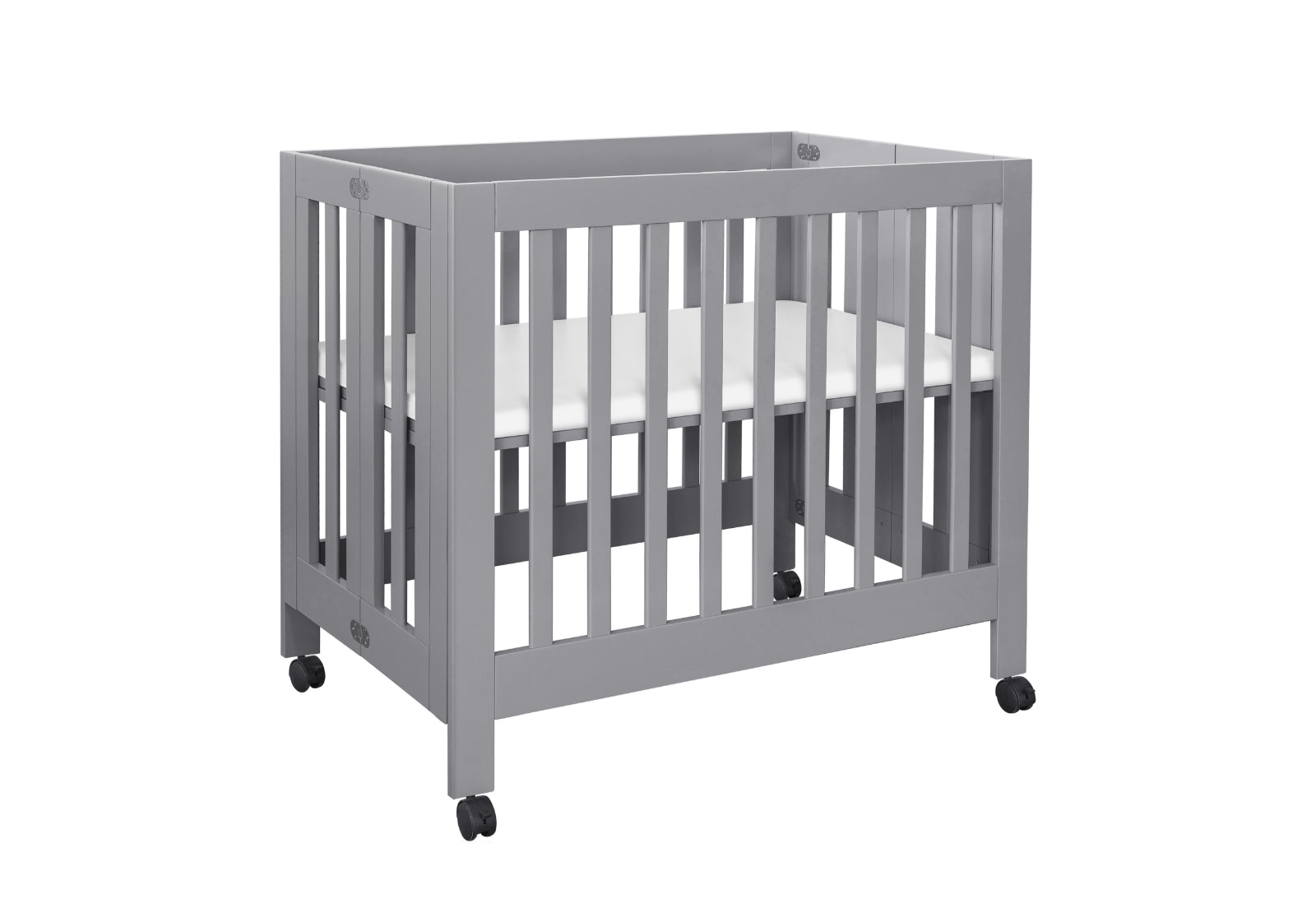 Gray modern baby crib with wheels on a white background.