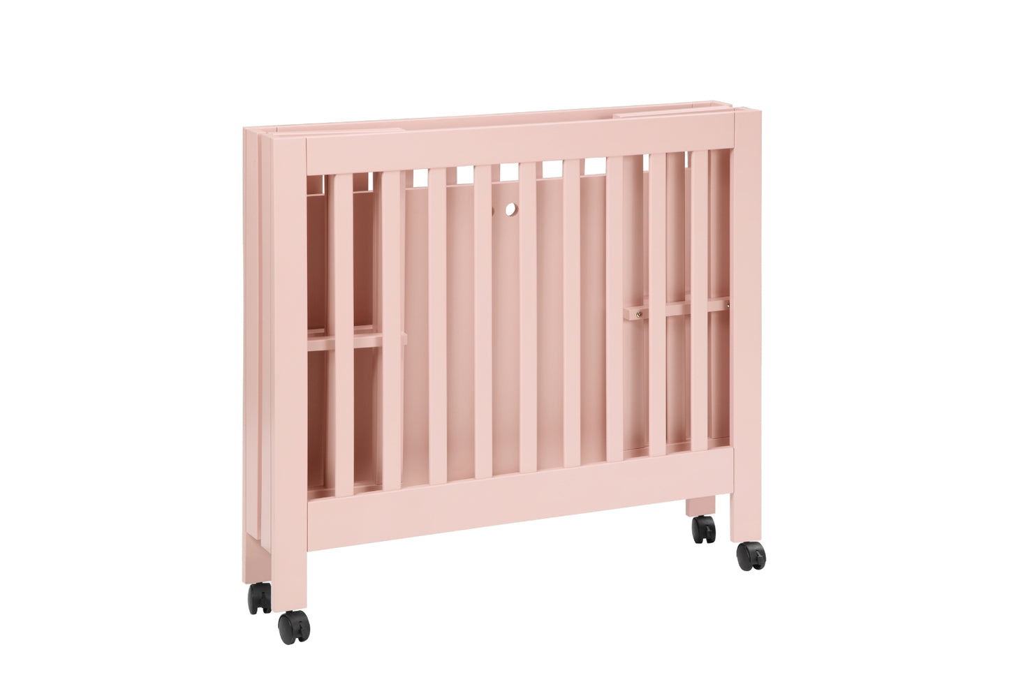 A pale pink baby crib on wheels with vertical slats, against a white background.