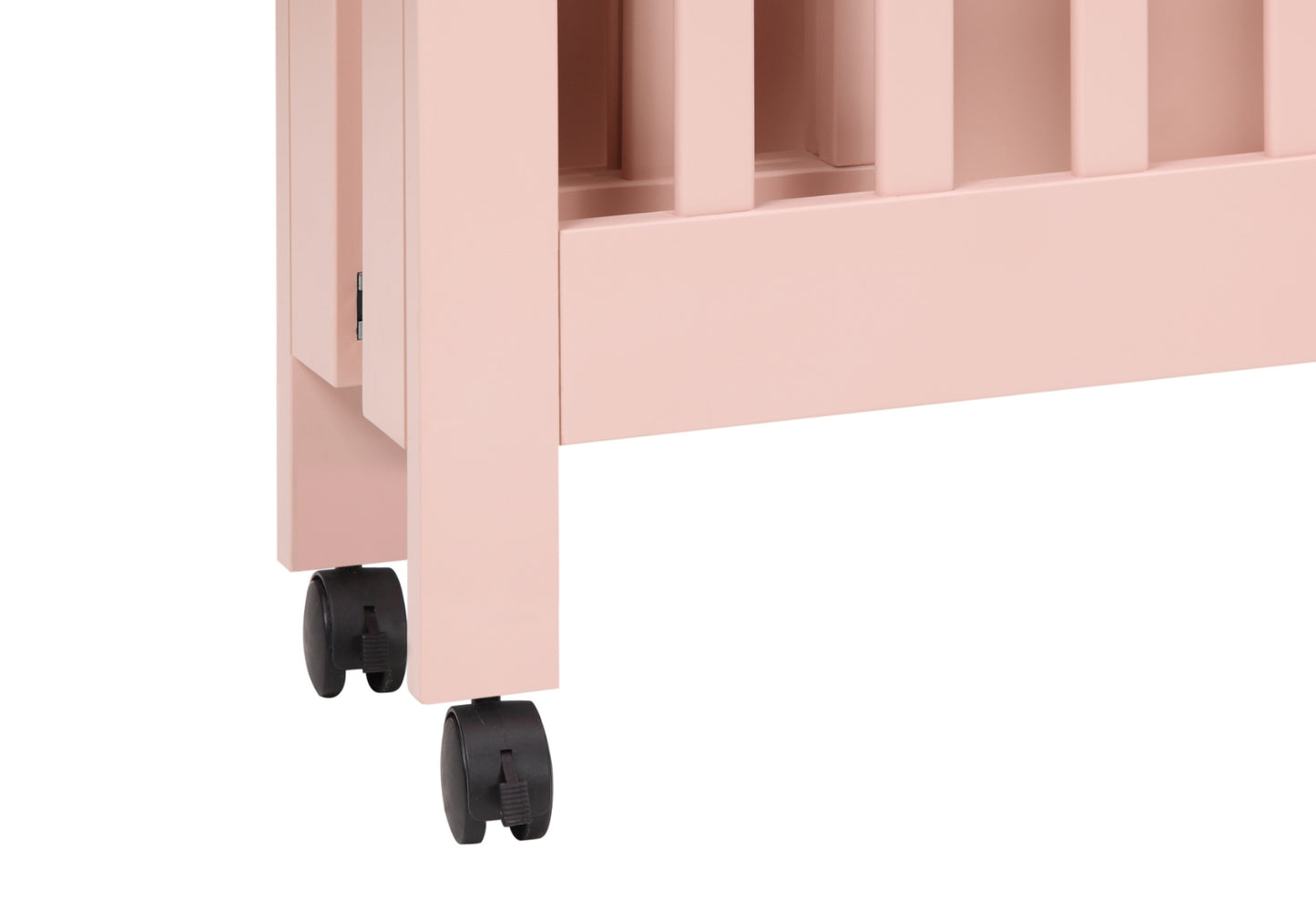 A close-up image of the corner of a pink baby crib with visible wheels and a detailed side panel.