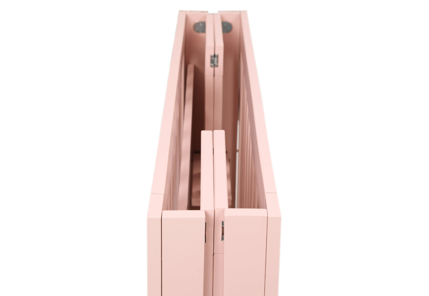 Close-up view of a pink foldable crib's hinges and craftsmanship details.
