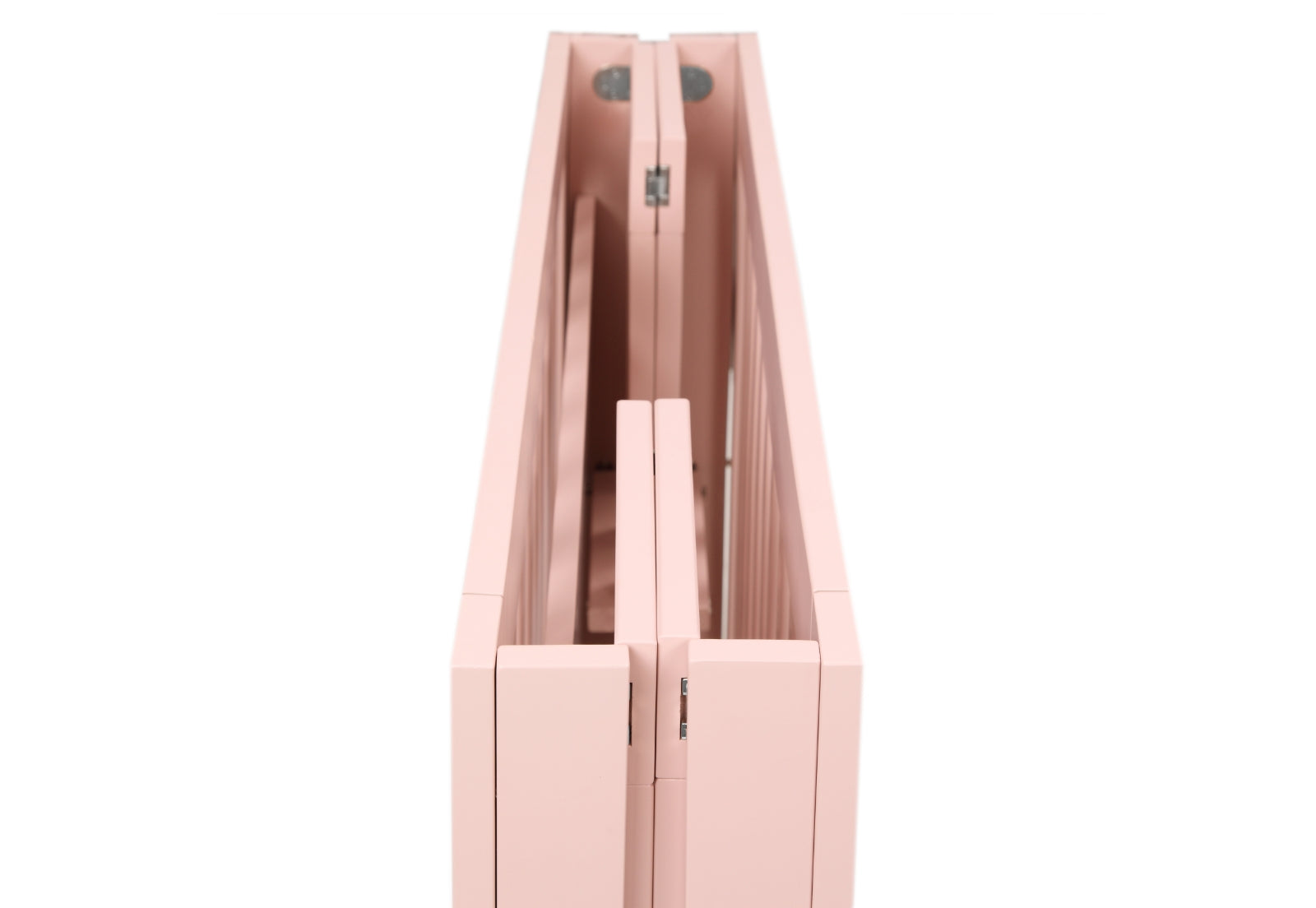 Close-up view of a pink foldable crib's hinges and craftsmanship details.