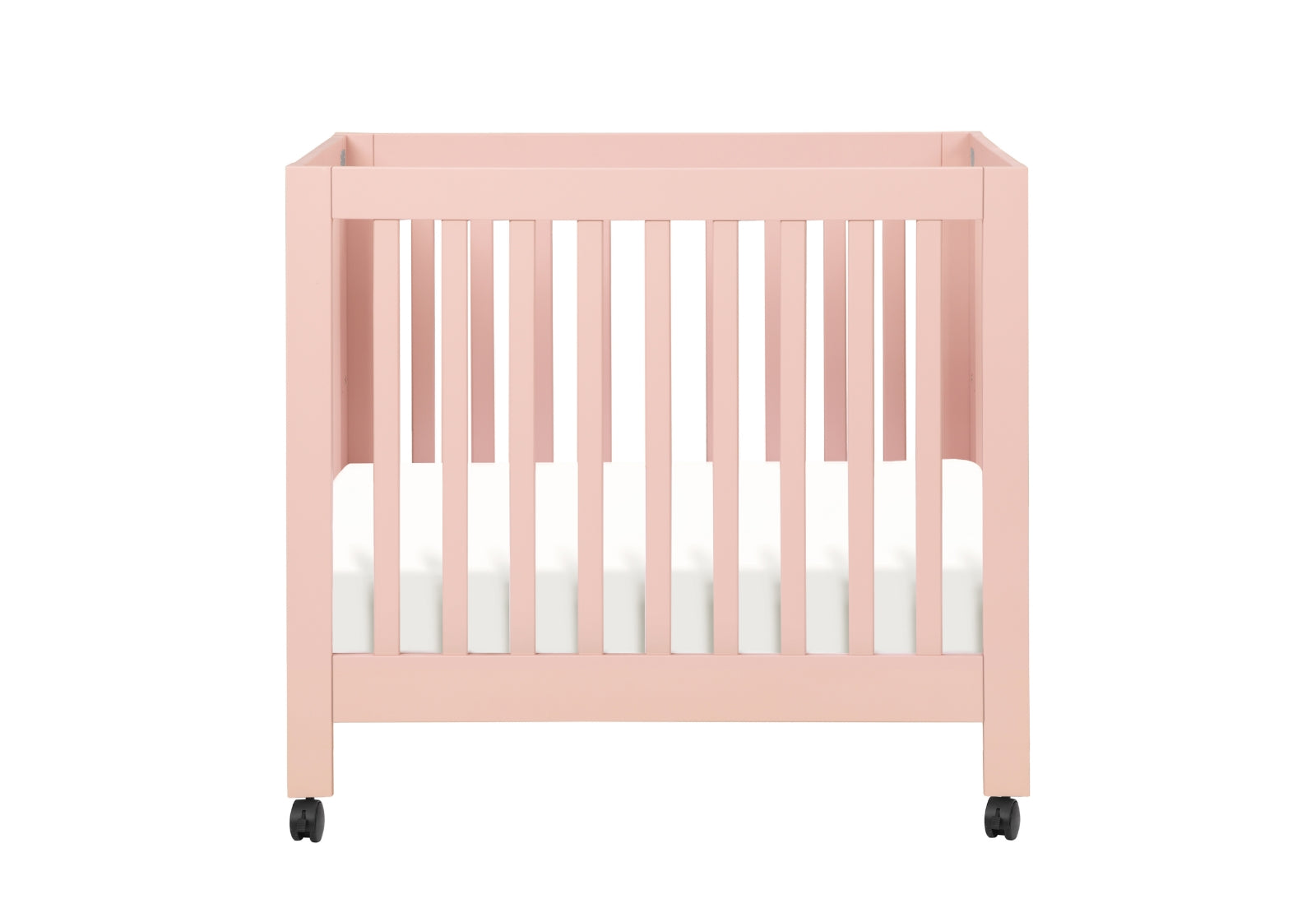 Pink baby crib on wheels with a white mattress, isolated on a white background.