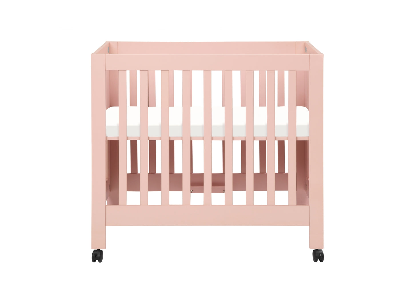 A minimalist pink baby crib with white mattress on wheels.