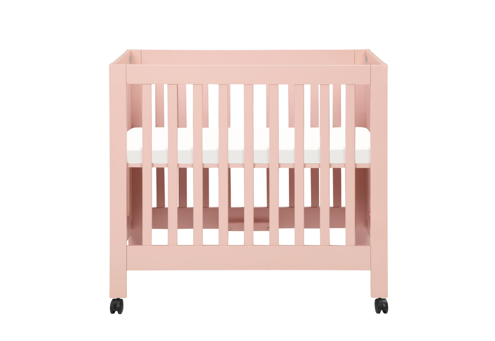 A minimalist pink baby crib with white mattress on wheels.
