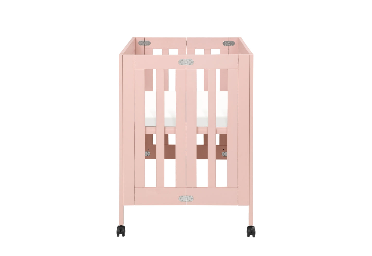 Light pink baby crib on wheels with vertical slats and visible locking mechanisms on the corners.