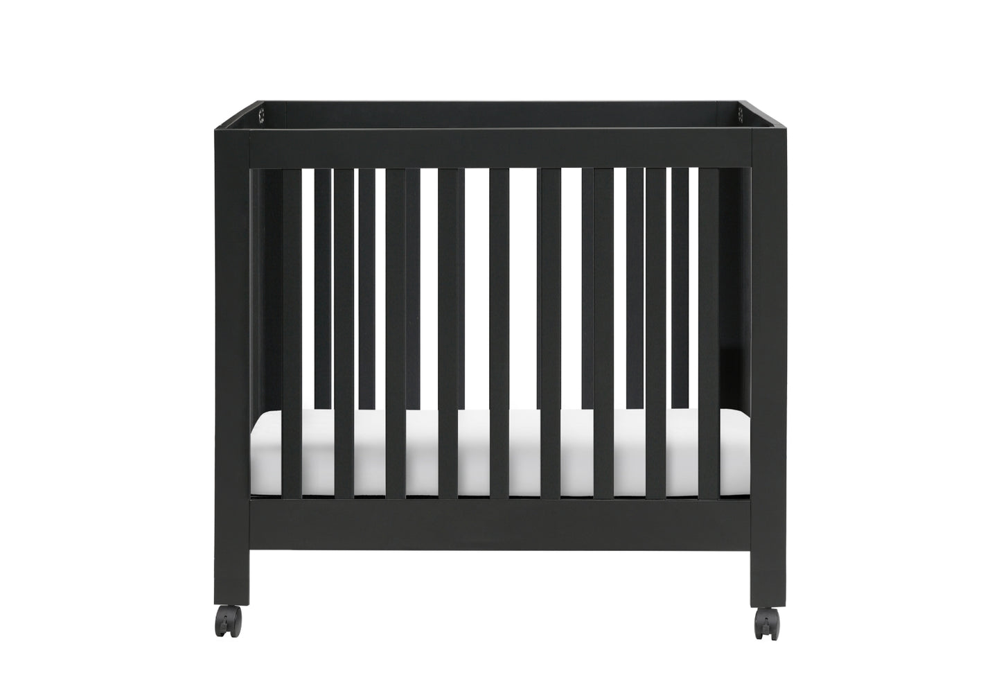 Modern black crib on wheels with visible mattress against a white background.