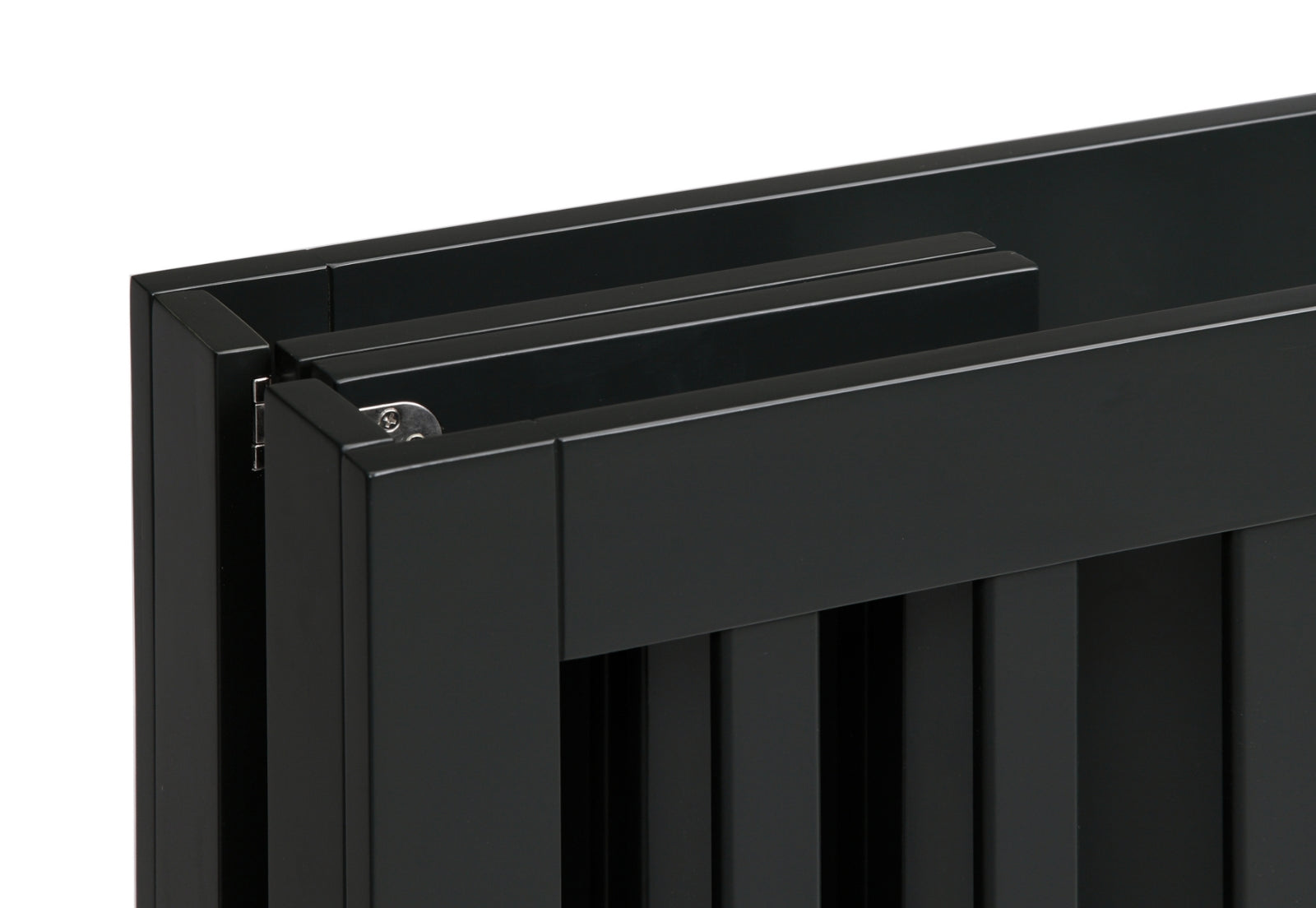 Close-up of a black crib showing detail of corner construction and finish.