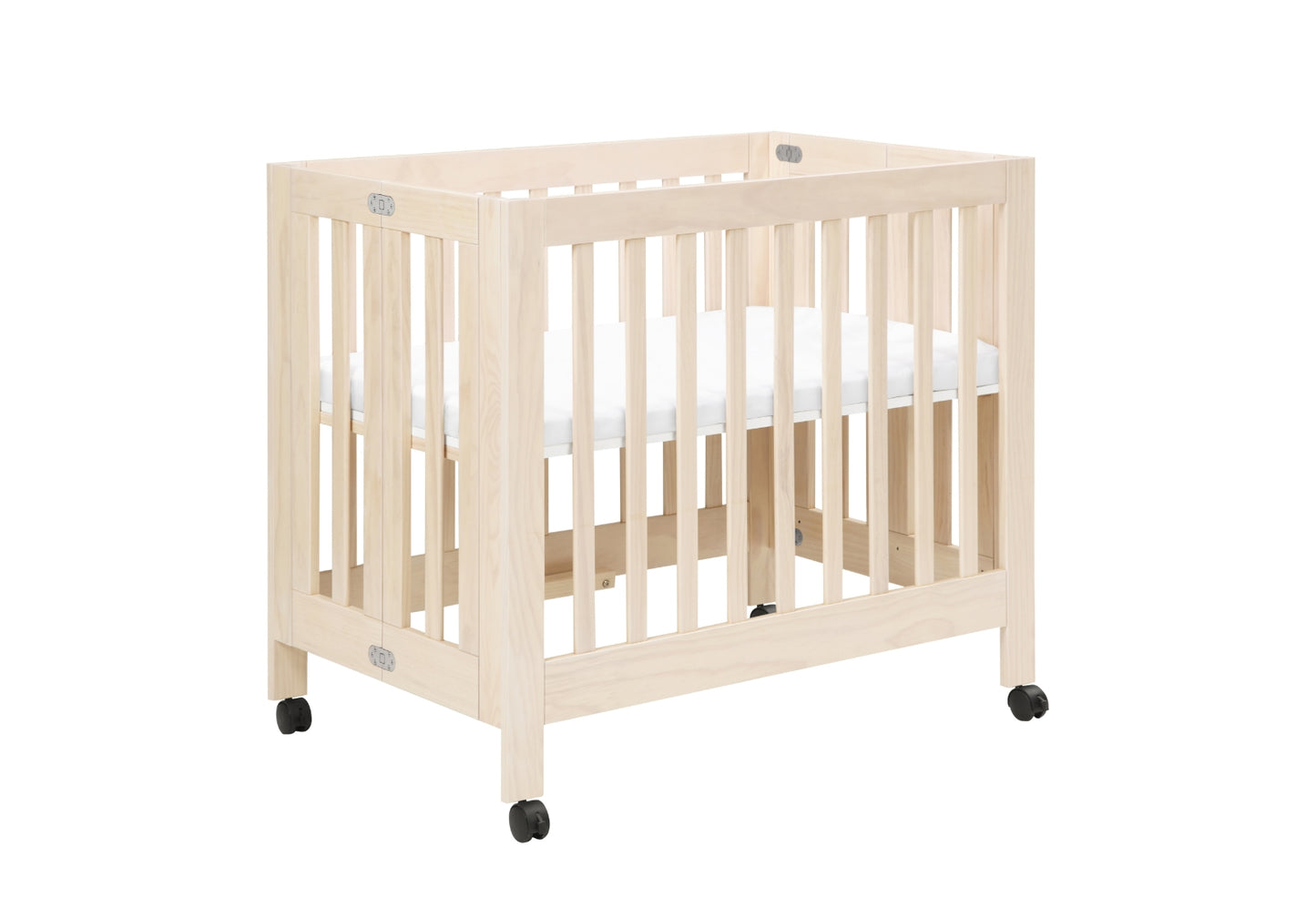 Natural wood baby crib on wheels with visible mattress, isolated on a white background.