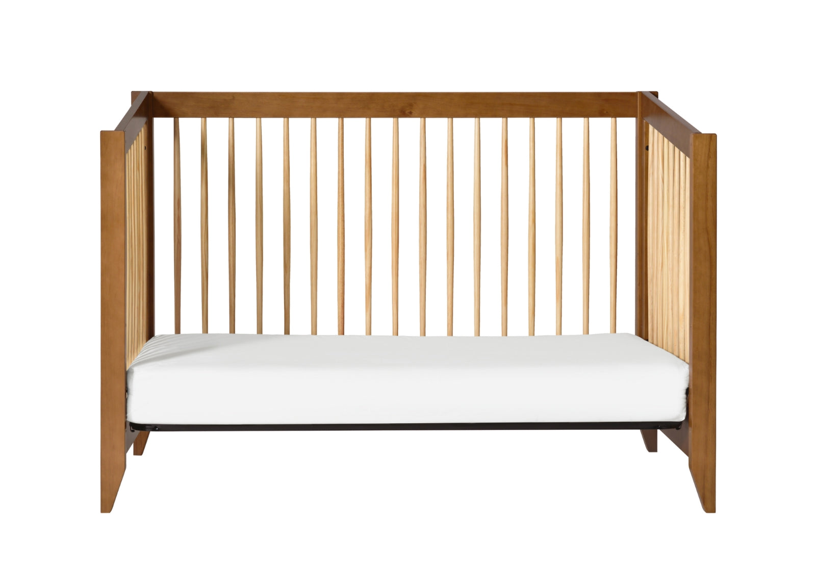 The Babyletto Sprout Convertible Crib features vertical slats on three sides and a white mattress, shown from the front against a white background—a perfect nursery furniture choice.