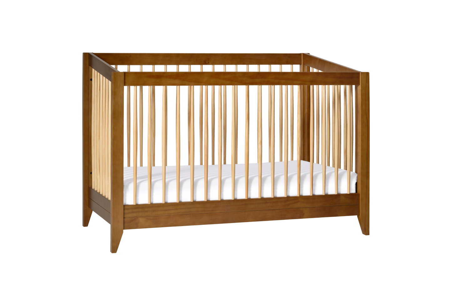 The Babyletto Sprout Convertible Crib features vertical slats on all sides and includes a white mattress, making it ideal for any nursery. Shown against a plain white background.