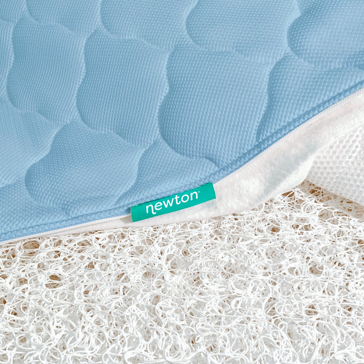 close up of newton mattress cover and innovative newton wovenaire core